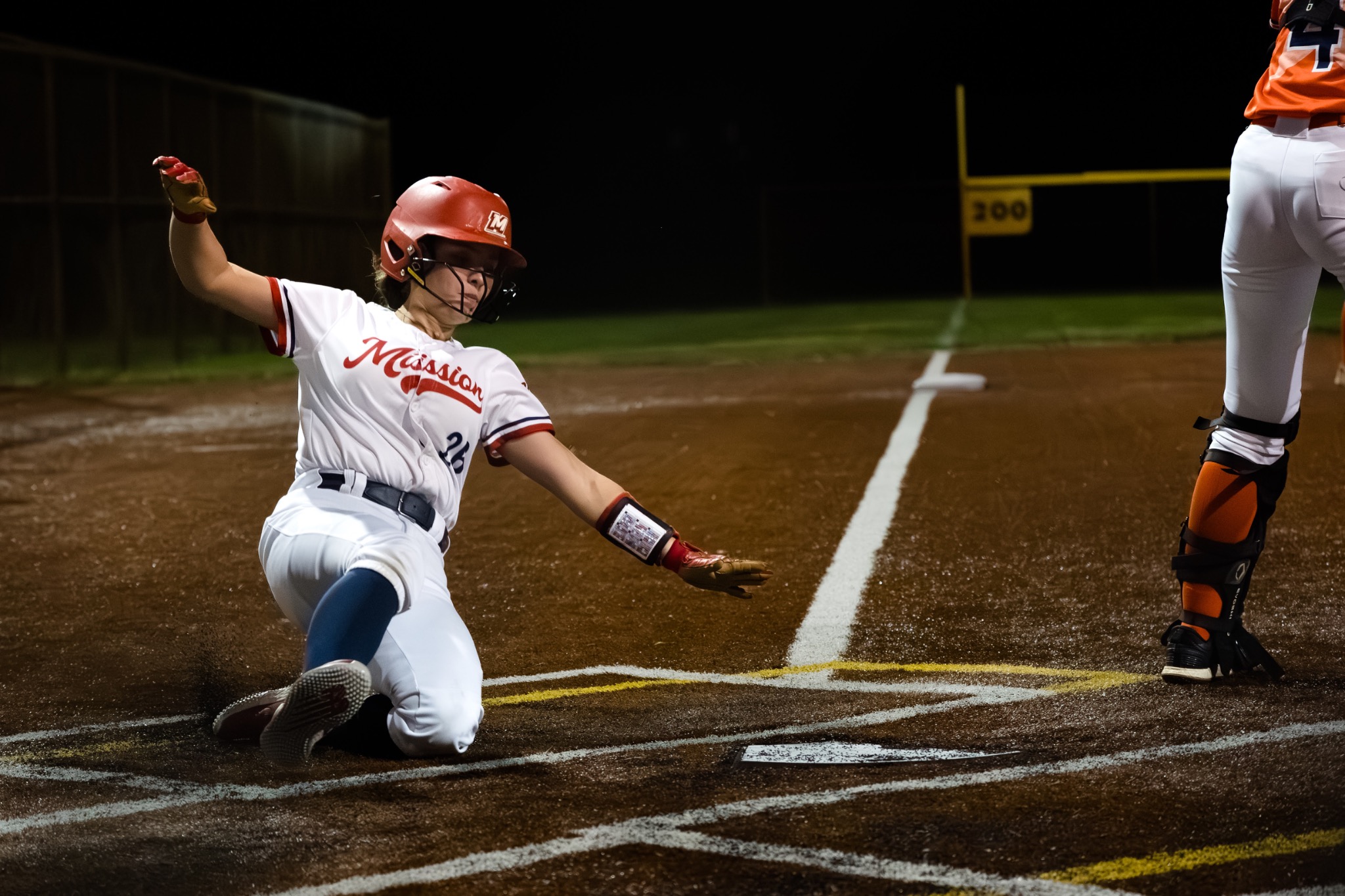 Mission runner sliding safely into home plate